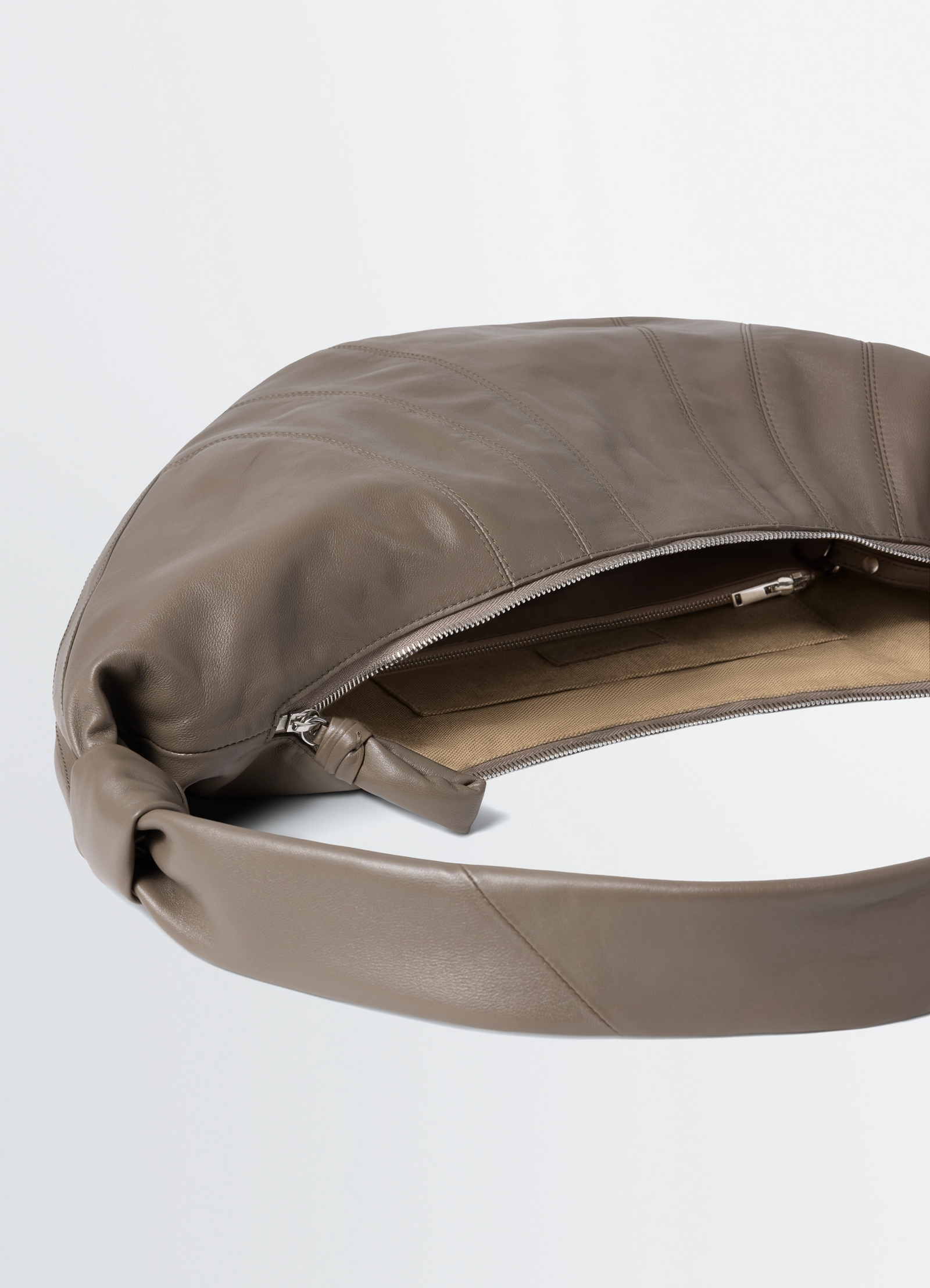 Lemaire large croissant bag in nappa lamb leather, product shot, side view exposed zipper
