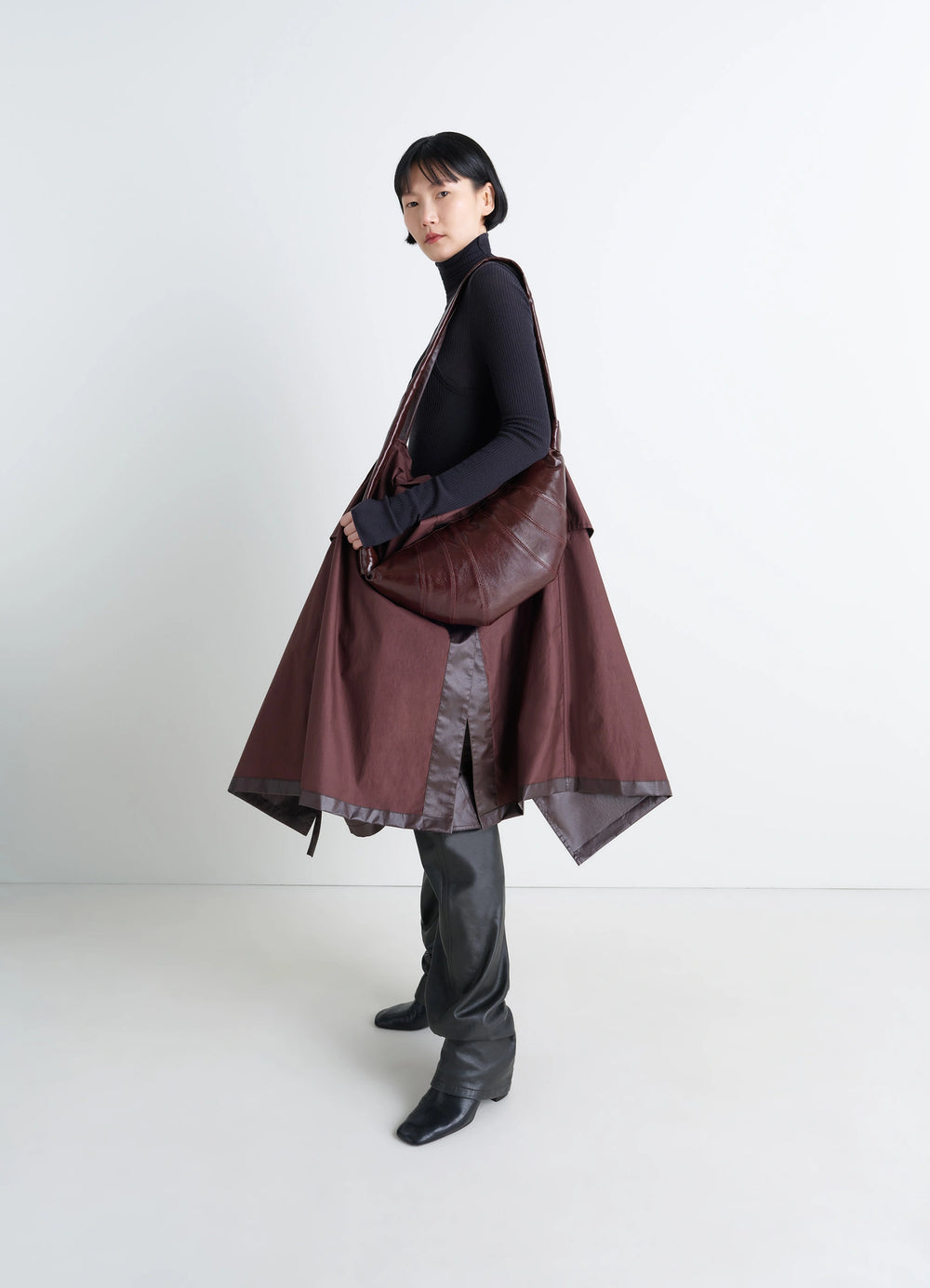 Lemaire Medium Croissant Bag in Brown Coated Cotton Canvas, model shot, three-quarter view crossbody styling