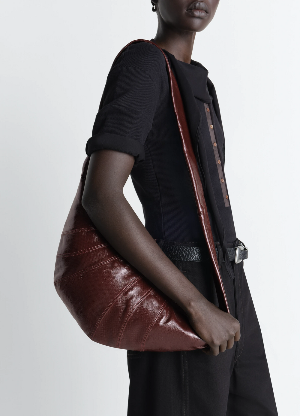 Lemaire Medium Croissant Bag in Coated Cotton, model shot, over-the-shoulder view smooth textured finish