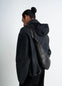 Lemaire Medium Croissant Bag in Black Nappa Lamb Leather, model shot, back view knotted elements
