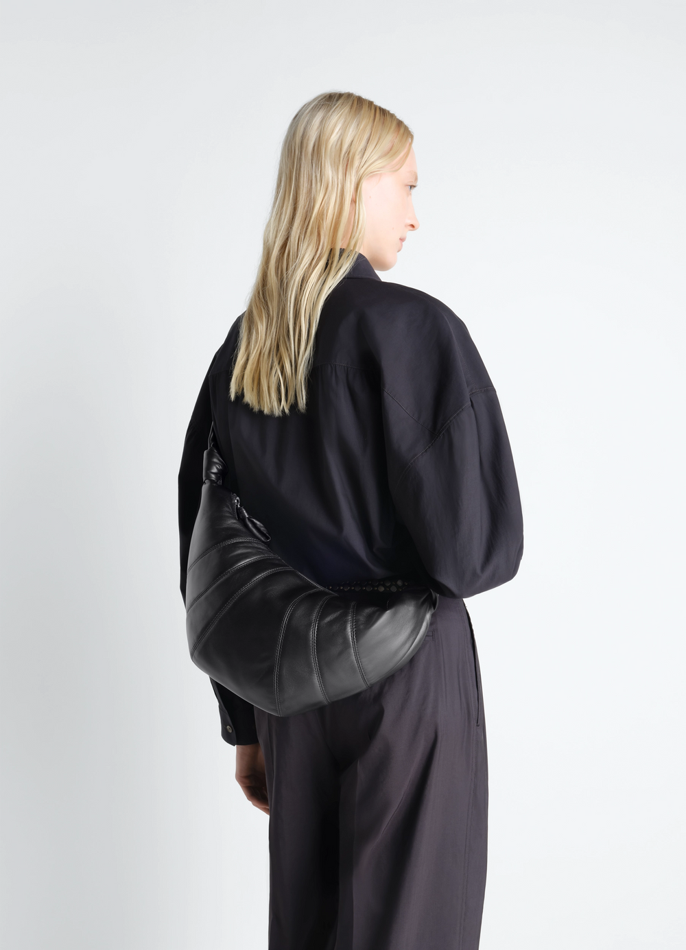 Medium Croissant Bag in Leather in Nappa lamb leather, model shot, back view draped over shoulder