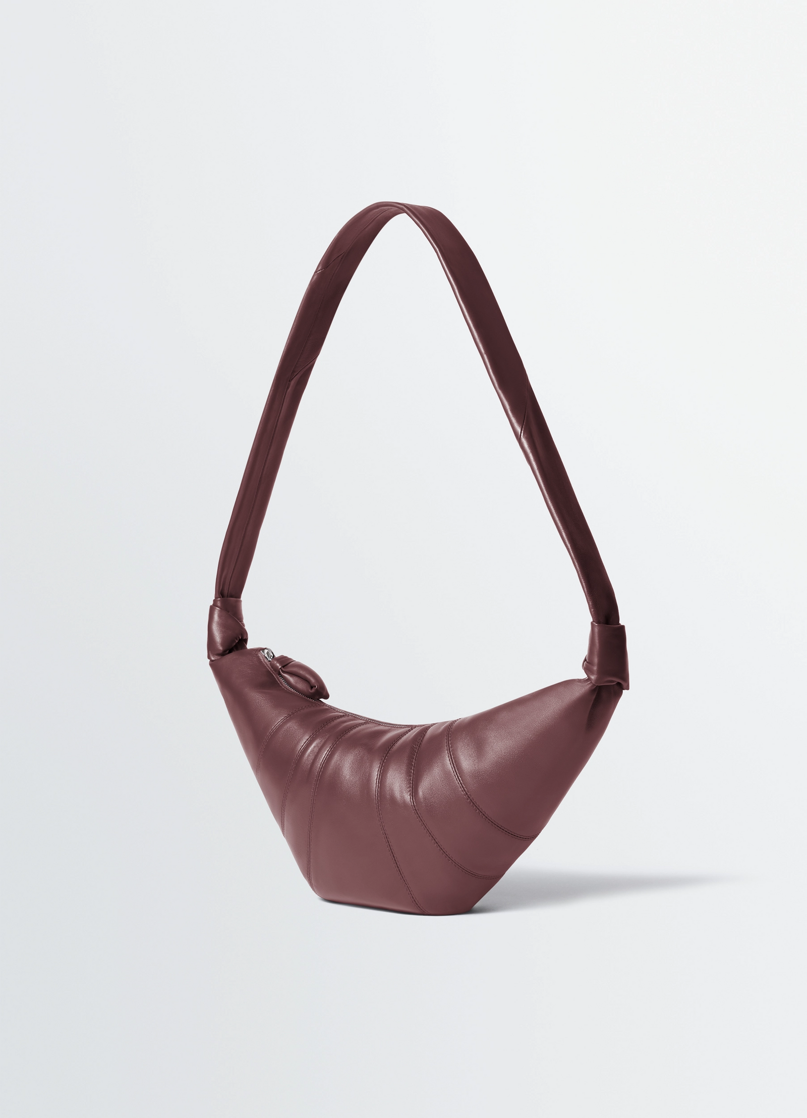 Fortune croissant bag in soft nappa lambskin, product shot, angled top view pleated pattern, long strap