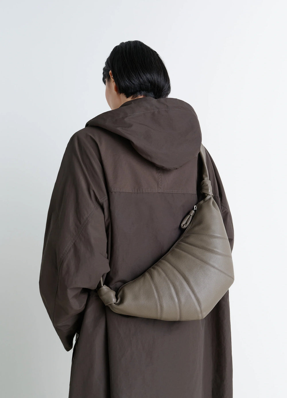 Medium Croissant Bag in Grained Leather, model shot, over-the-shoulder view curved structure