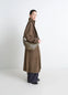 Lemaire Medium Croissant Bag in Nappa Lamb Leather, model shot, Side view Brown coat style context
