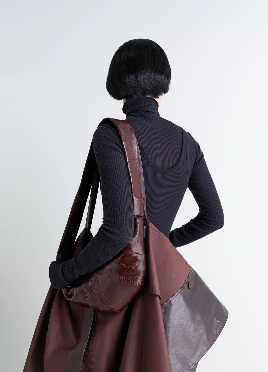 Lemaire Small Croissant Bag in Coated Cotton Canvas, model shot, Back view Curved design