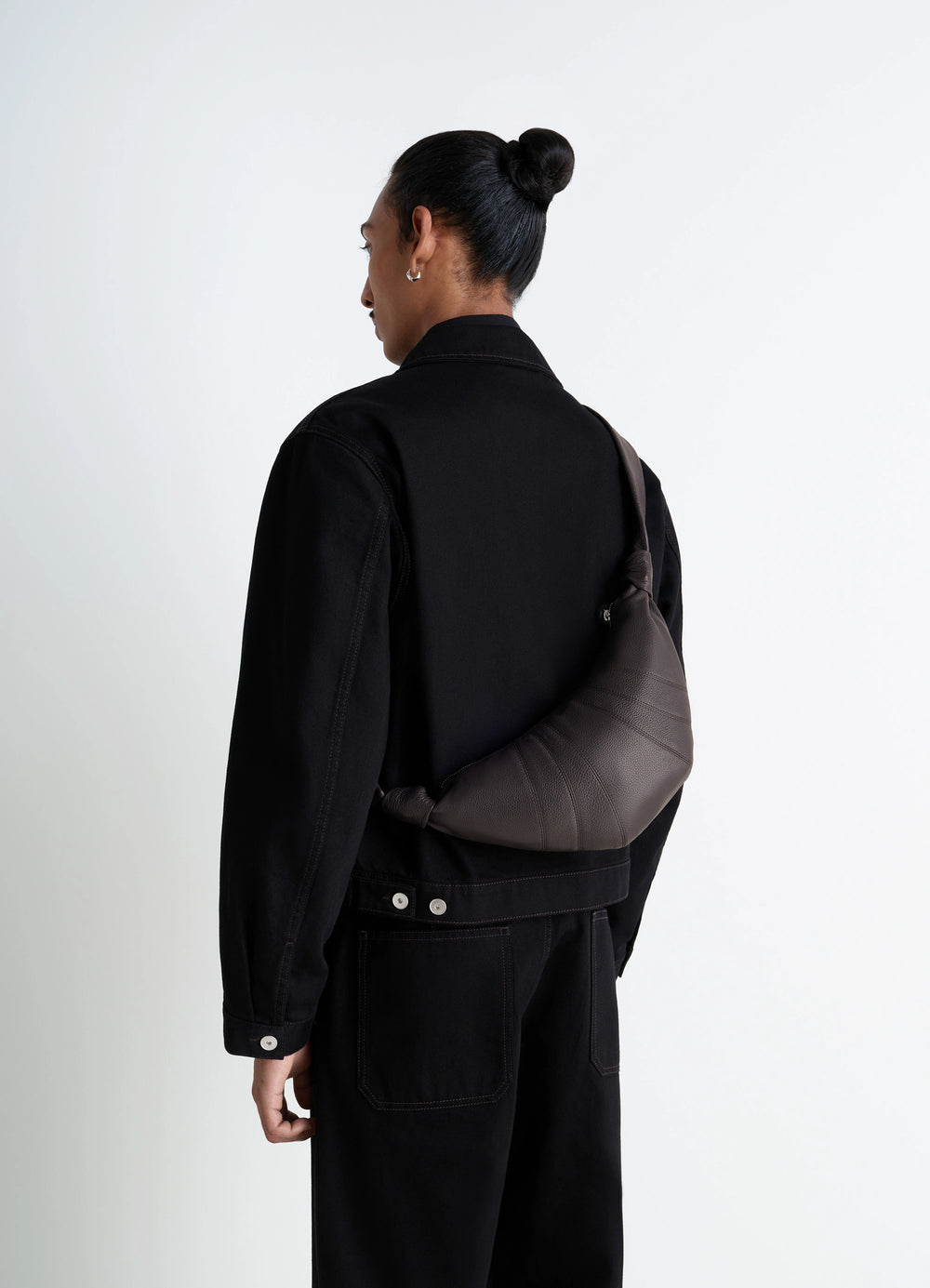 Lemaire Small Croissant Bag in Grained Leather, model shot, over the shoulder view grained texture accent