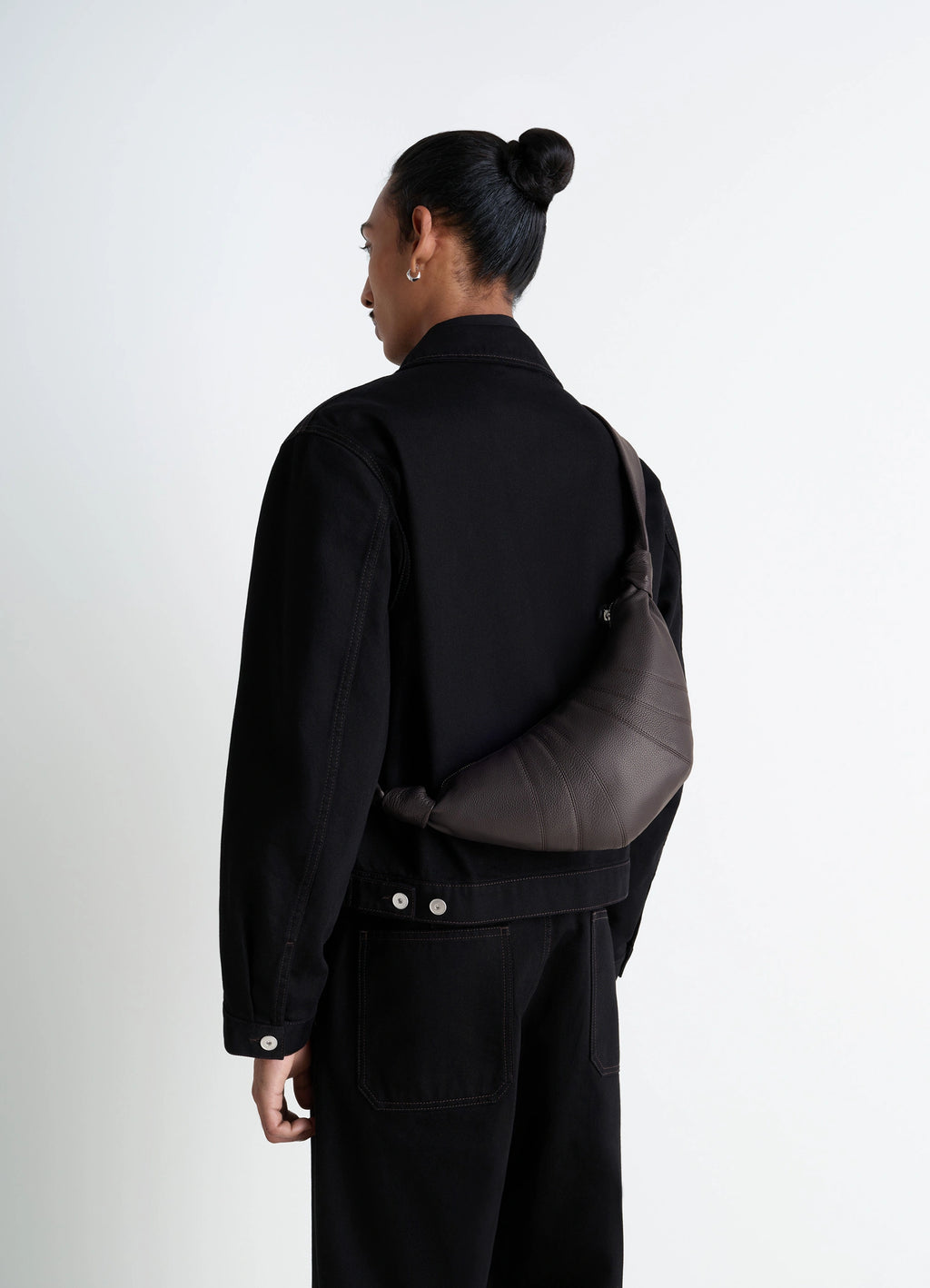 Lemaire Small Croissant Bag in Grained Leather, model shot, over the shoulder view grained texture accent