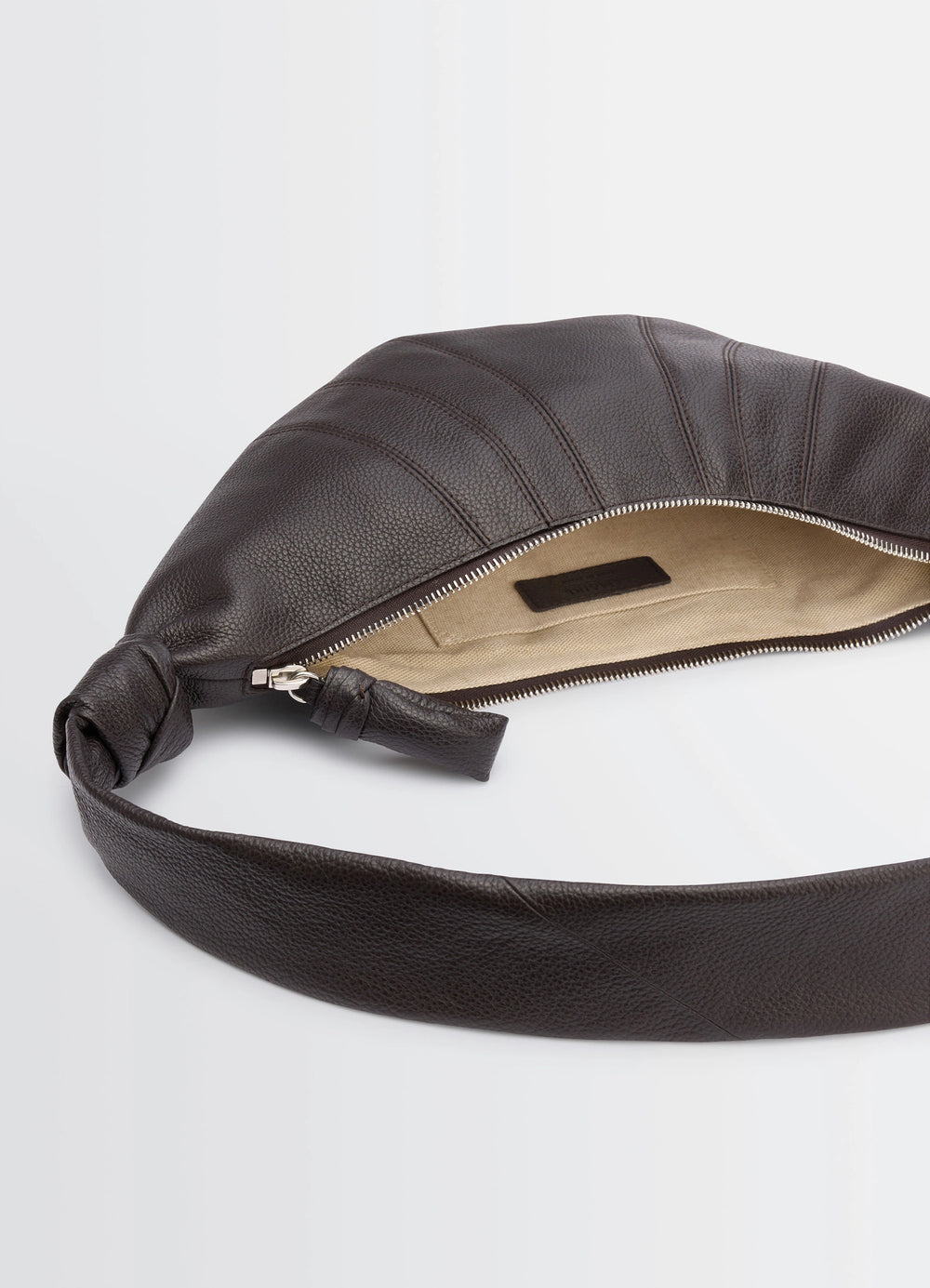Lemaire Small Croissant Bag in Grained Leather, product shot, top detail view inside zipper accent