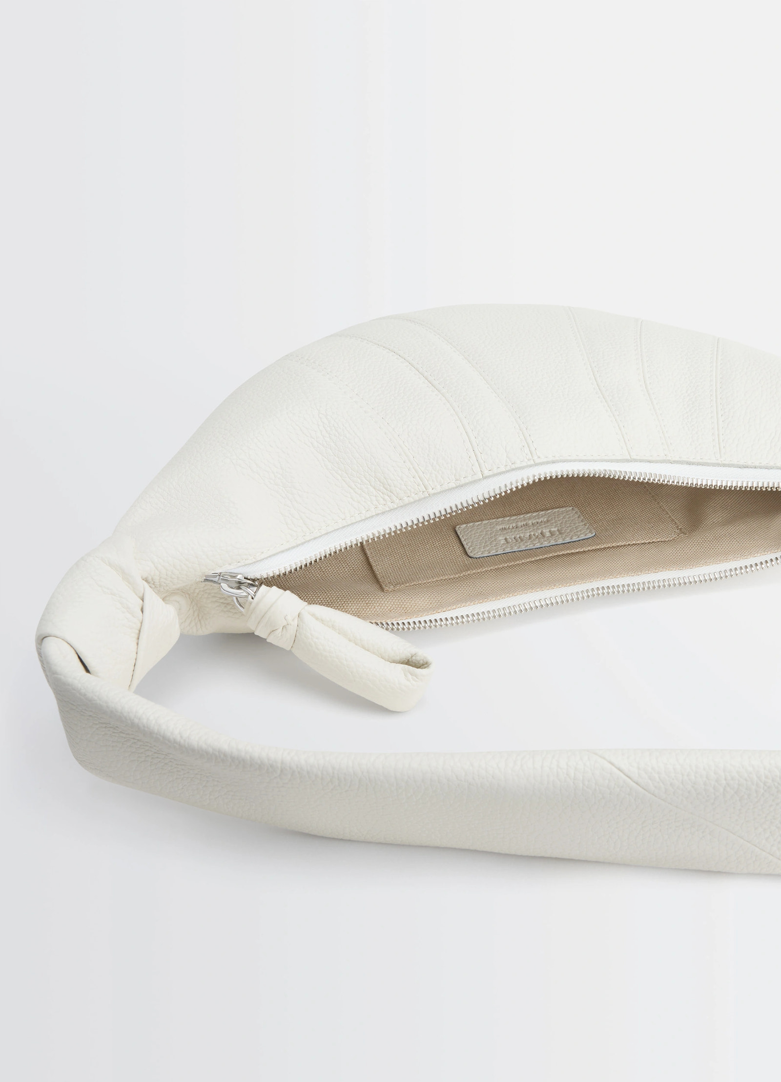 Lemaire small croissant bag in soft grained leather, product shot, top open view showing interior label