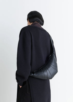 Lemaire Small Croissant Bag in Black Nappa Lamb Leather, model shot, Back view Knotted strap detail