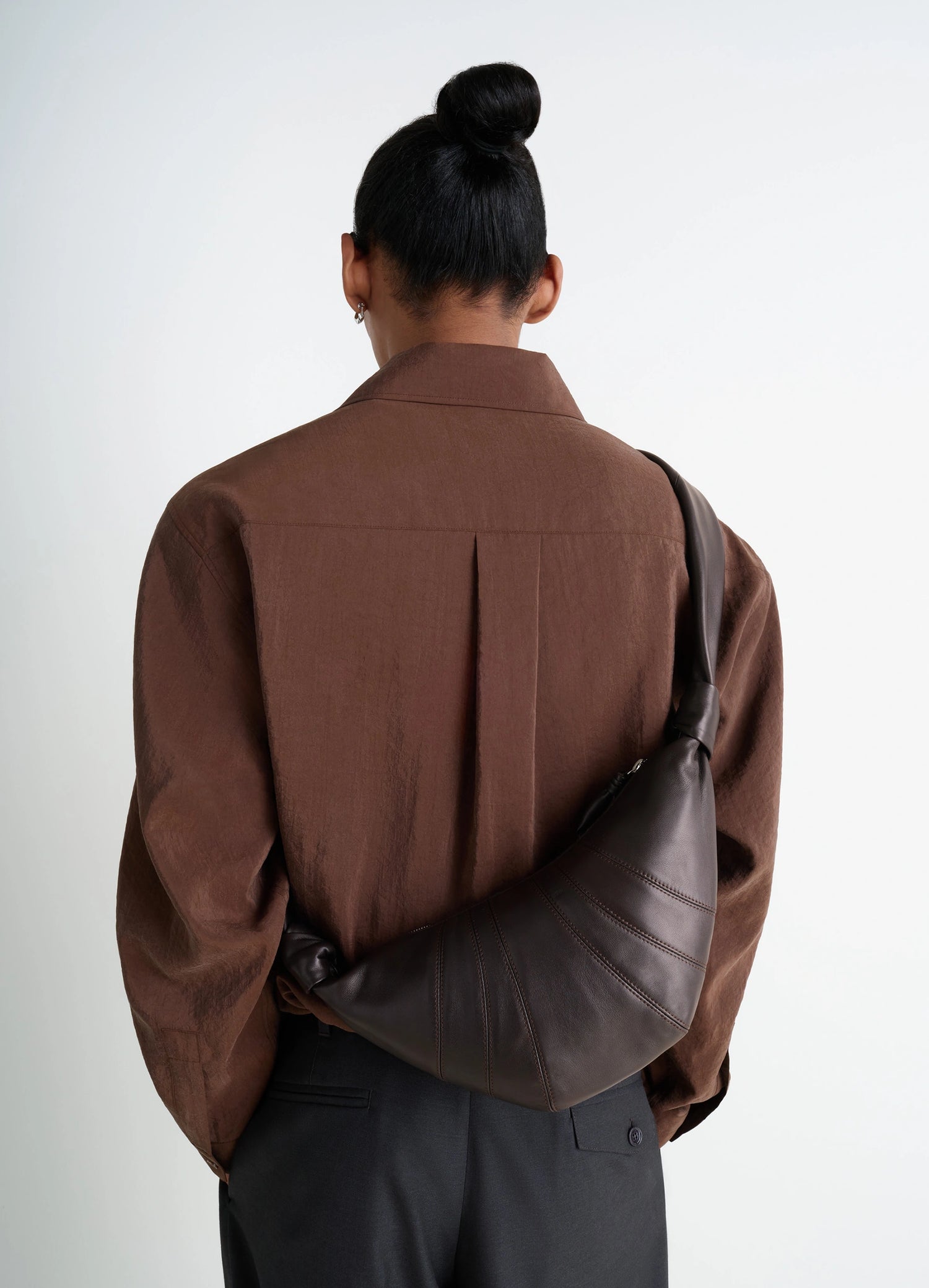 Lemaire Small Croissant Bag in Nappa Lamb Leather, model shot, Back view Supple curve design