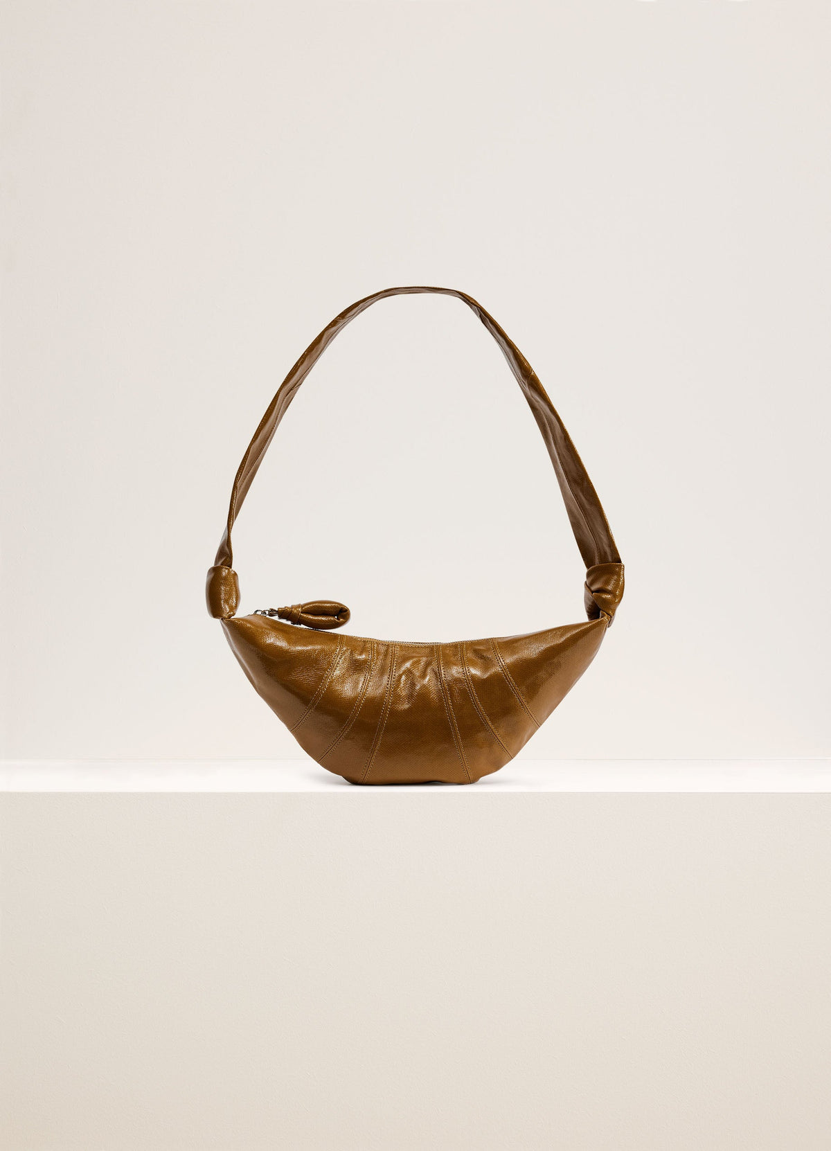 Lemaire Small Croissant Bag in Coated Cotton Brown, product shot, Front View Curved Design with Zip