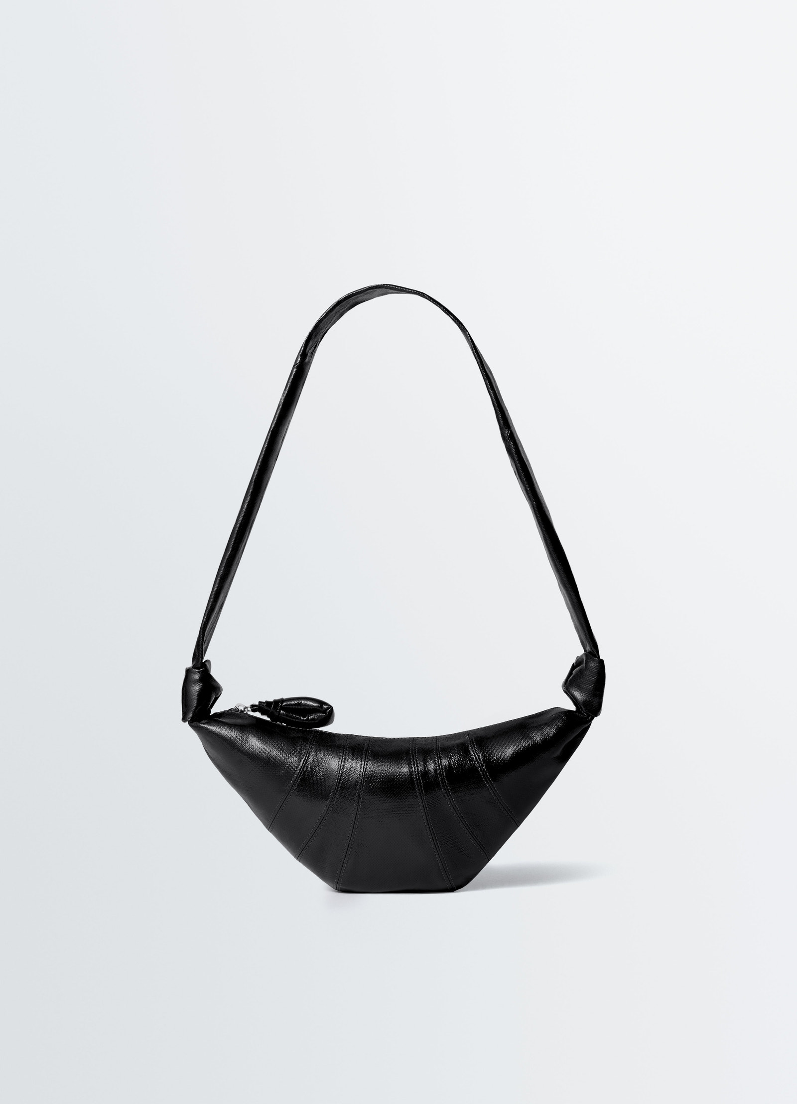 Small black coated cotton croissant bag lemaire front view on plain white background