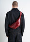 Lemaire Small Croissant Bag in Coated Cotton Canvas, model shot, Back view Textured shiny look