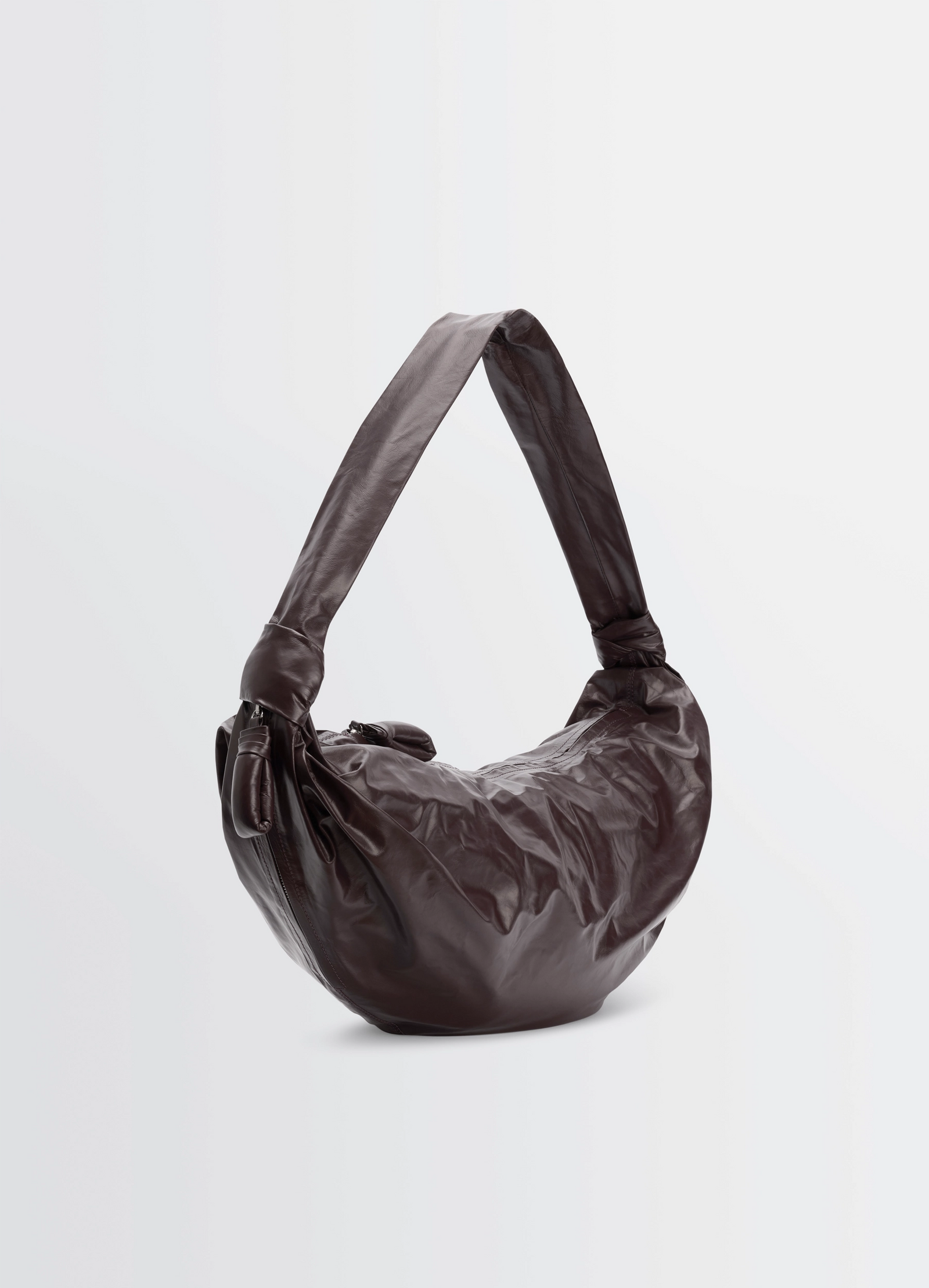 Large soft croissant bag in paper-effect leather, product shot, three-quarter view soft slouchy form