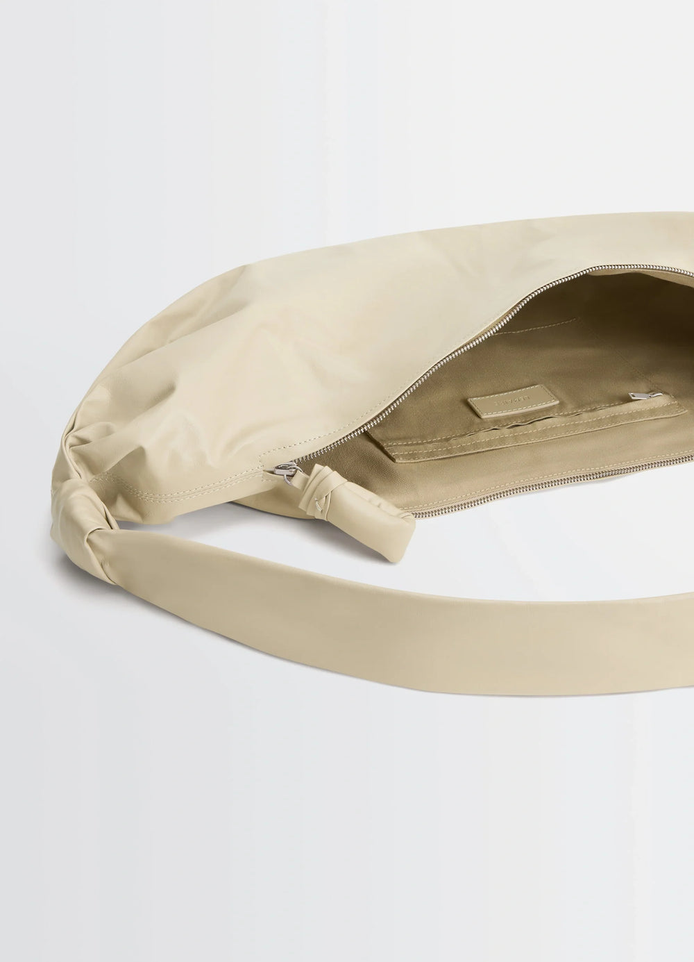 Lemaire Large Soft Croissant in Paper-effect leather, product shot, interior detail view open zipper, interior pocket