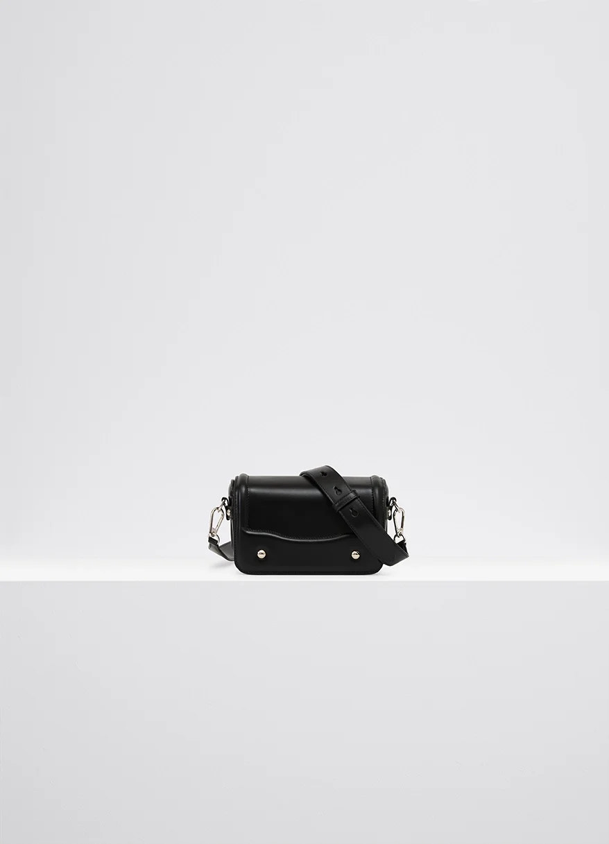 Lemaire ransel mini satchel in glossy black vegetable-tanned leath, product shot, front view rectangular body with flap
