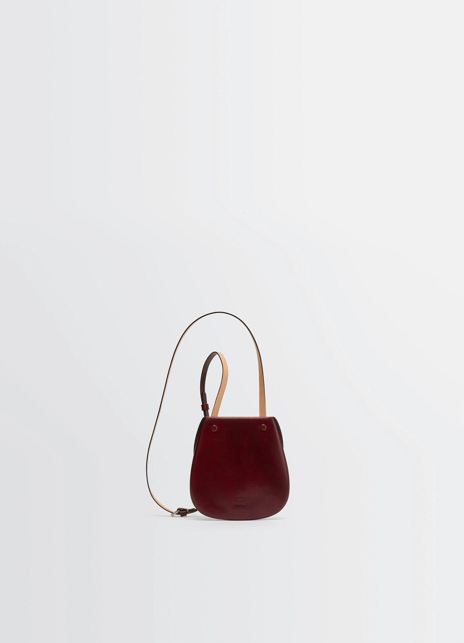 Il bussetto for lemaire small cartr in patinated vegetable-tanned leather, product shot, angled top view polished finish with