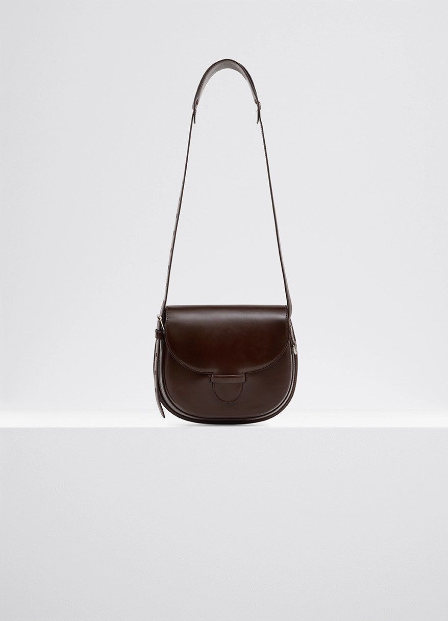 Lemaire cartridge sport bag in smooth vegetable-tanned leather, product shot, front view sophisticated lines