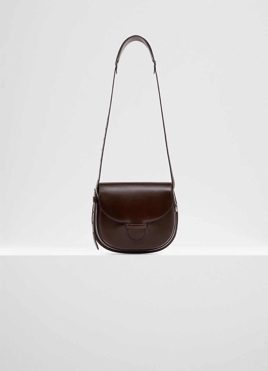 Lemaire Cartridge Sport Bag in smooth vegetable-tanned leather, product shot, front view sophisticated lines