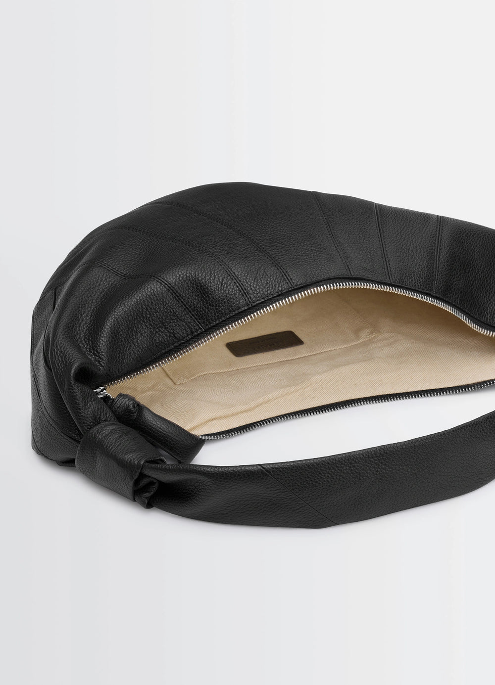 Fortune Croissant Bag in Grained Leather Black, product shot, interior view open zipper, inner lining