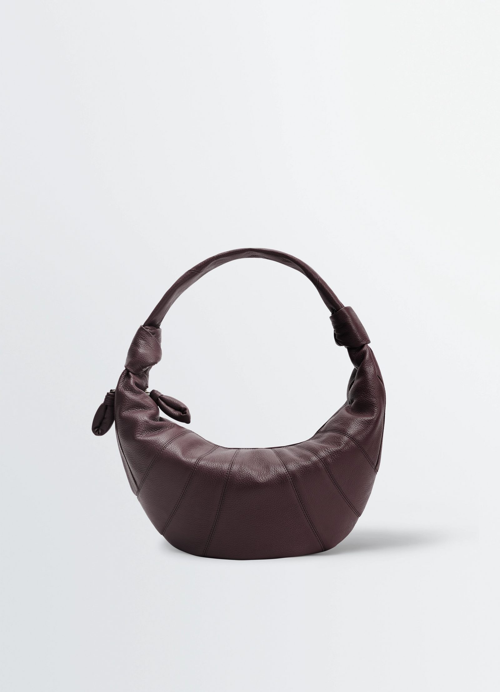 Fortune croissant bag in leather, product shot, side view half-moon shape, knotted elements