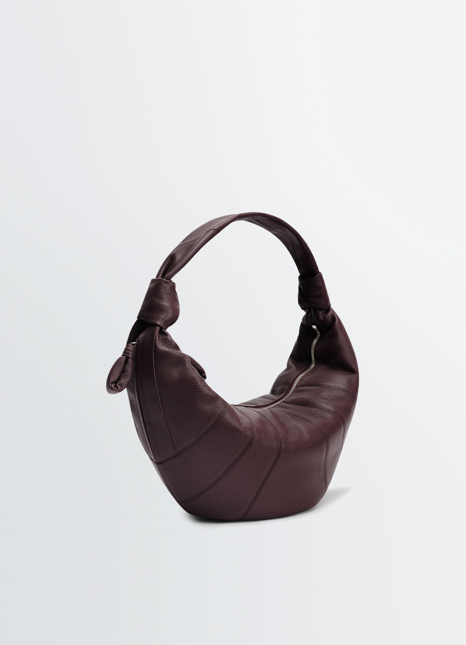 Fortune croissant bag in leather, product shot, angled view soft pleated contour