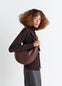 Fortune Croissant Bag in Grained Leather, model shot, Side view Knotted elements