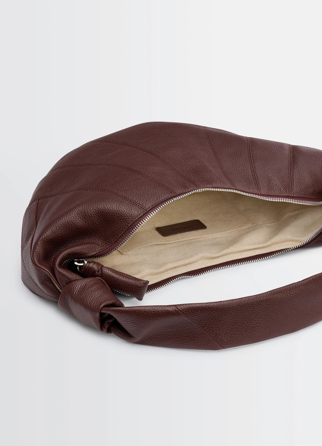 Fortune Croissant Bag in Grained Leather, product shot, top detail shot zip closure, open interior