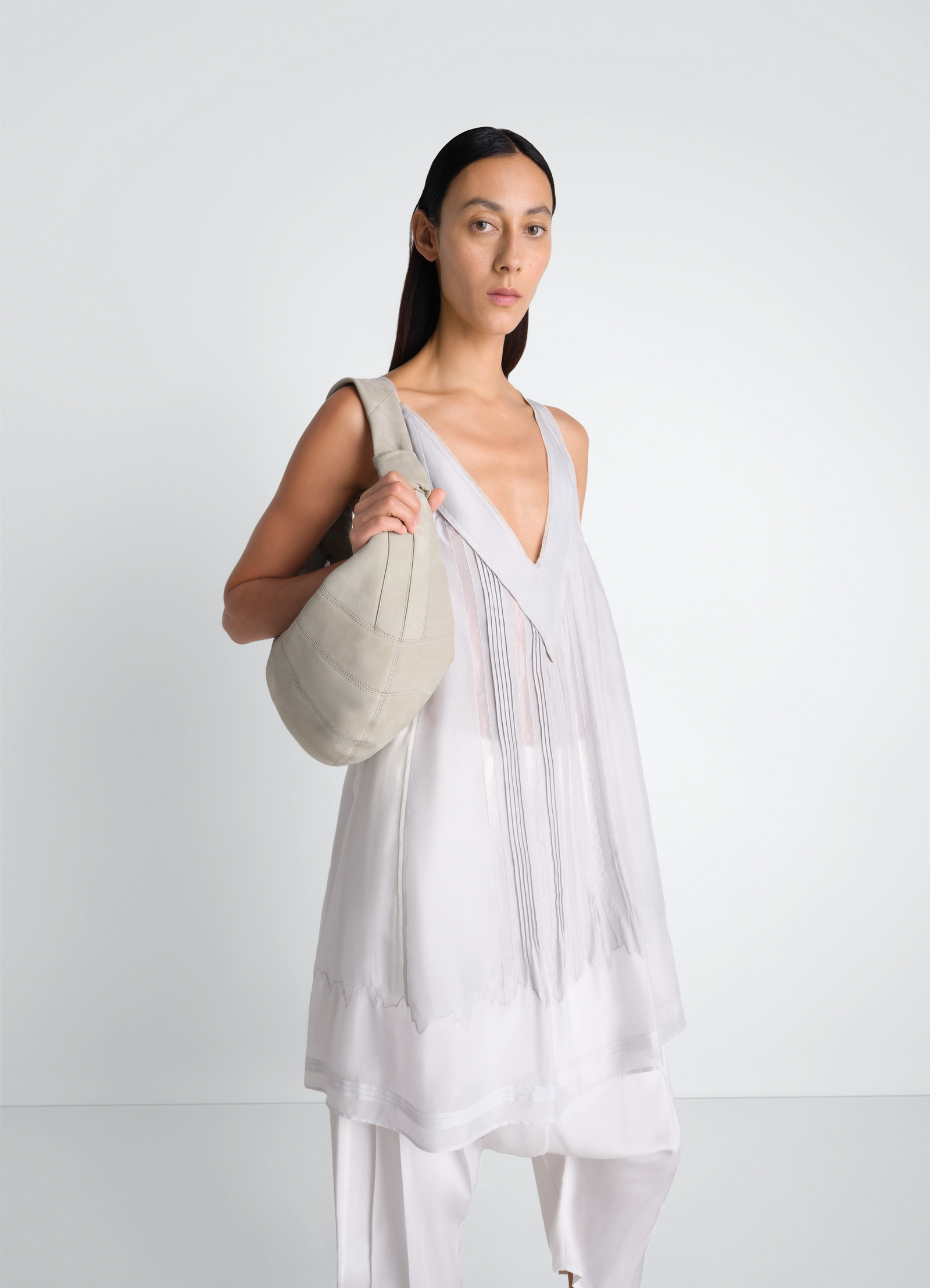 Fortune croissant bag in alpaca nubuck, model shot, over shoulder view slouchy soft texture