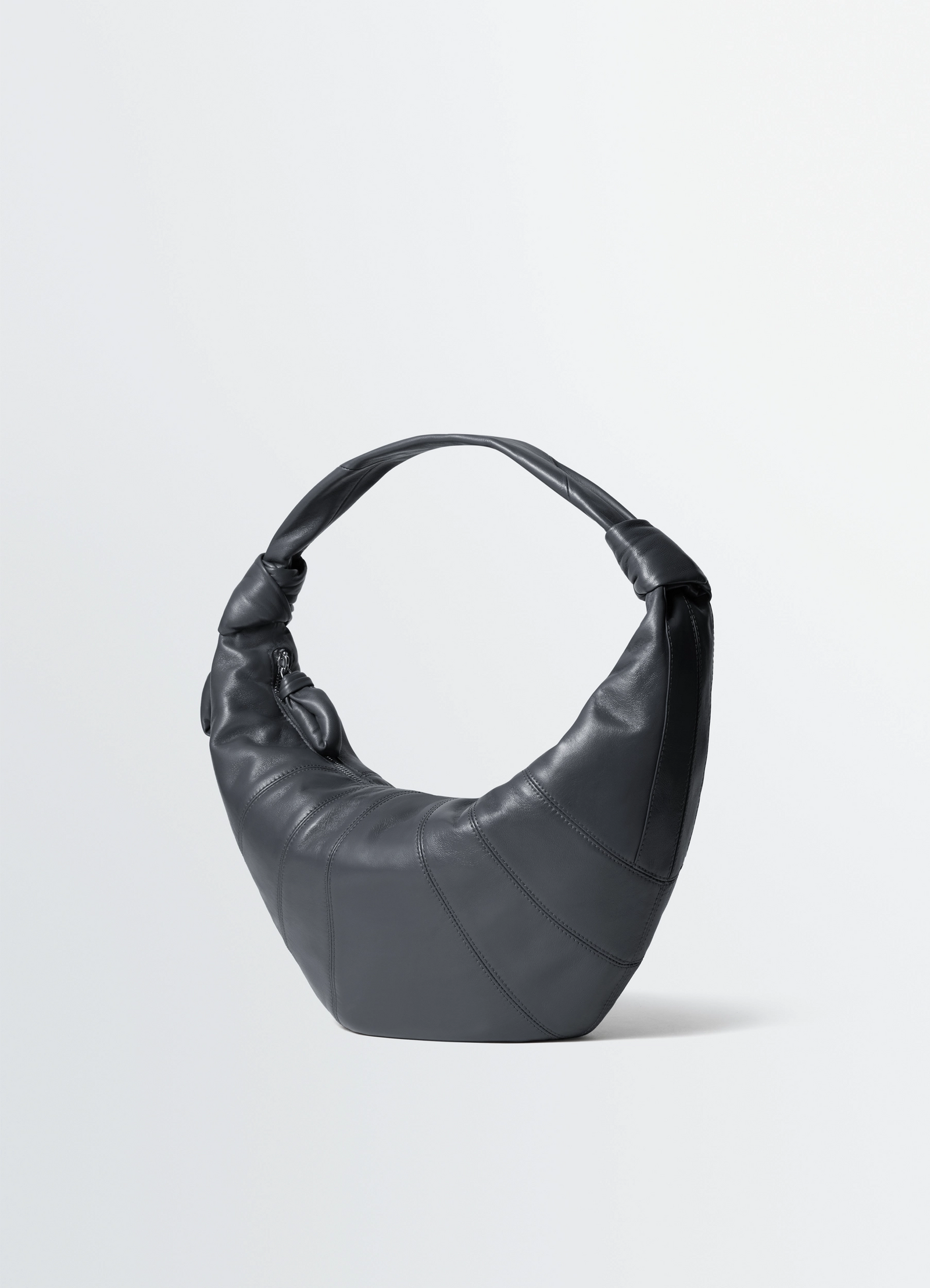 Fortune croissant bag in leather, product shot, three-quarter view wrapped handle design