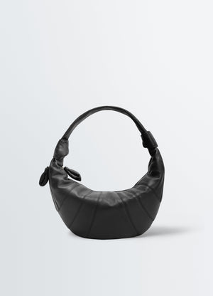 Fortune croissant leather bag in black with stitched detail lemaire front view on plain white background