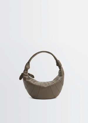 Fortune croissant bag in grained leather, product shot, front view curved handle