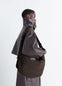 Medium Soft Game Bag in Quilted water-repellent nylon, model shot, Side view Embroidered eyelets