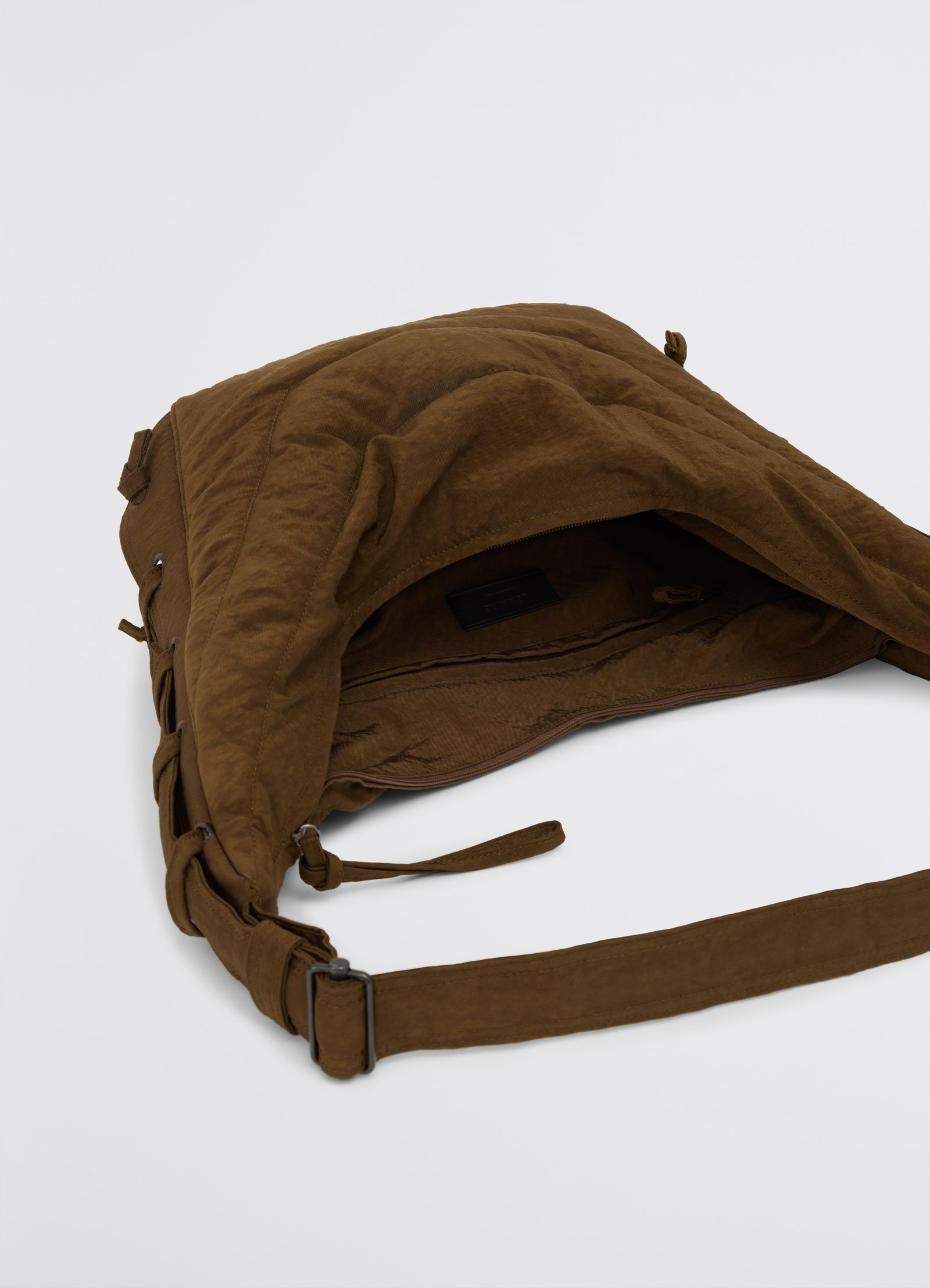 Medium soft game bag in fluffy nylon canvas, product shot, top-down view open main compartment