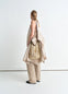 Lemaire Large Crossbody Filt Net Ba in Delicate nylon, dark chocolate leat, model shot, Back view Worn as cross-body