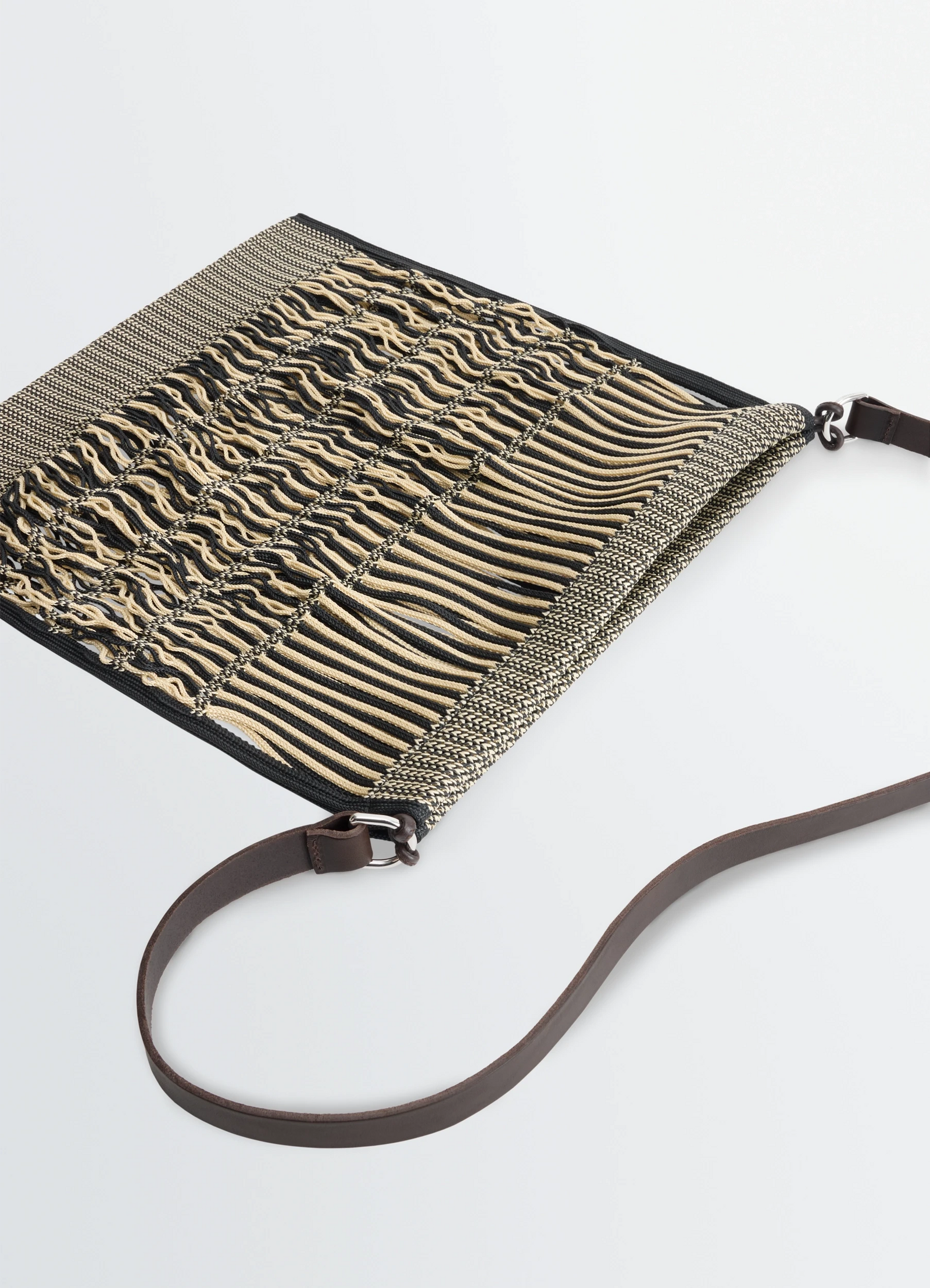 Lemaire large crossbody filt net sh in nylon mesh and vegetable-tanned lea, product shot, angled detail vie striped woven tas