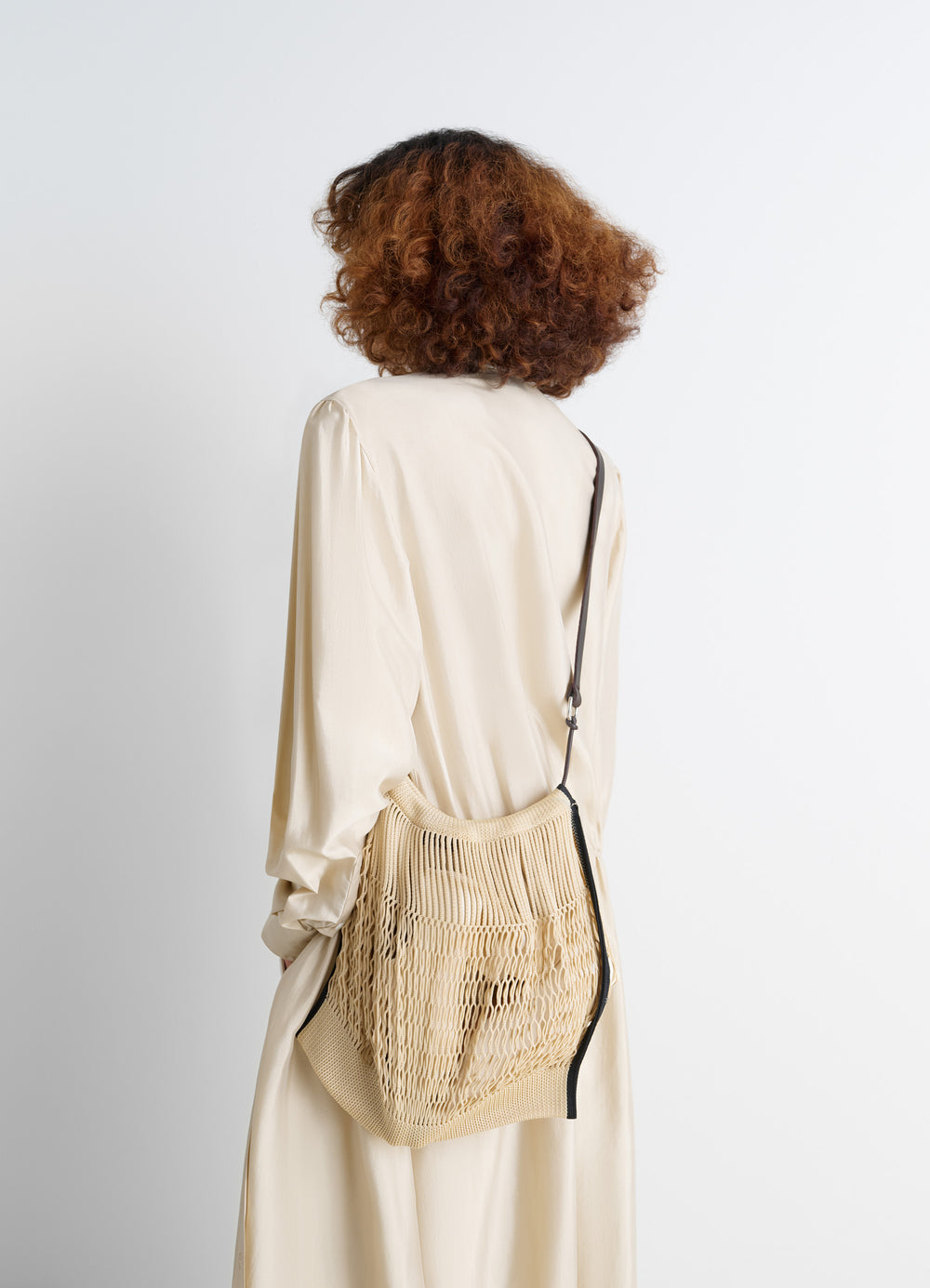 Lemaire Large Crossbody Filt Net Sh in Nylon mesh and vegetable-tanned lea, model shot, side angle mesh texture worn crossbod