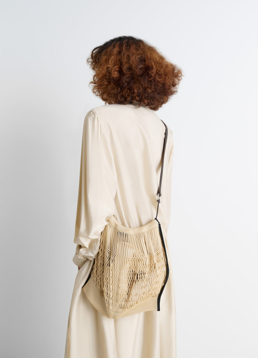 Lemaire Large Crossbody Filt Net Sh in Nylon mesh and vegetable-tanned lea, model shot, side angle mesh texture worn crossbod