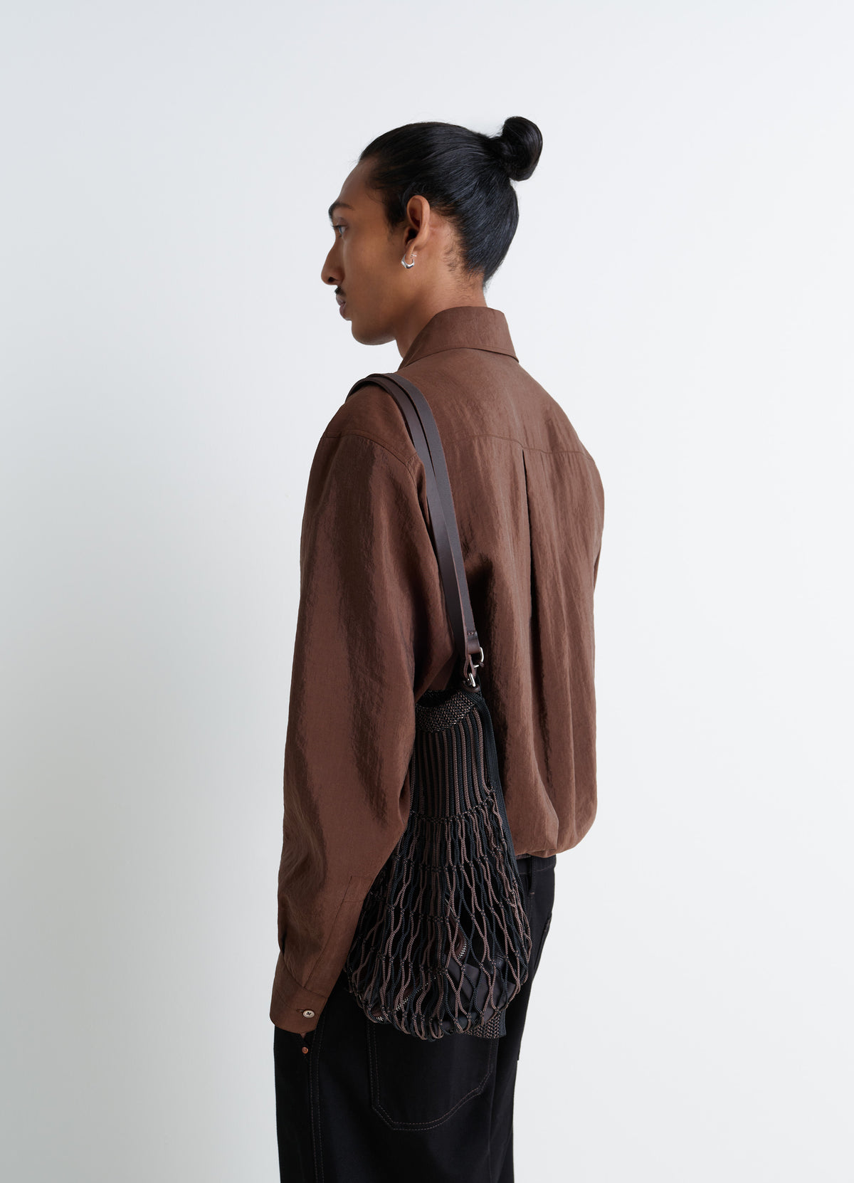 Lemaire Filt Net Shopping Bag in Nylon mesh, leather, model shot, Side view Shoulder strap detail