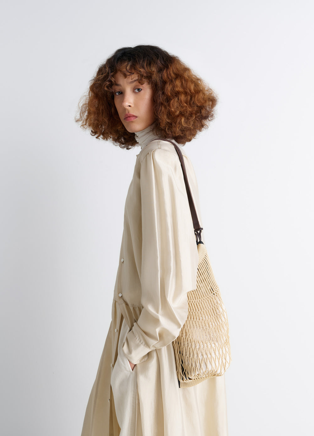 Medium Filt Net Shopping Bag in Nylon Mesh and Leather, model shot, Side view Worn over shoulder