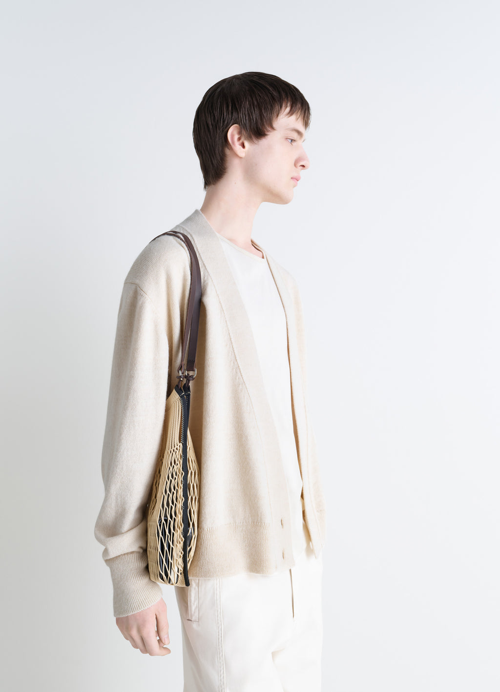 Medium Filt Net Shopping Bag in Nylon Mesh and Leather, model shot, three-quarter view bag resting on hip