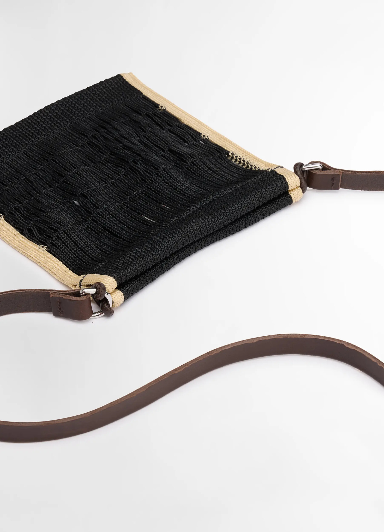 Mini crossbody filt net bag in dark chocolate leather, nylon, product shot, angled detail shot woven texture closeup