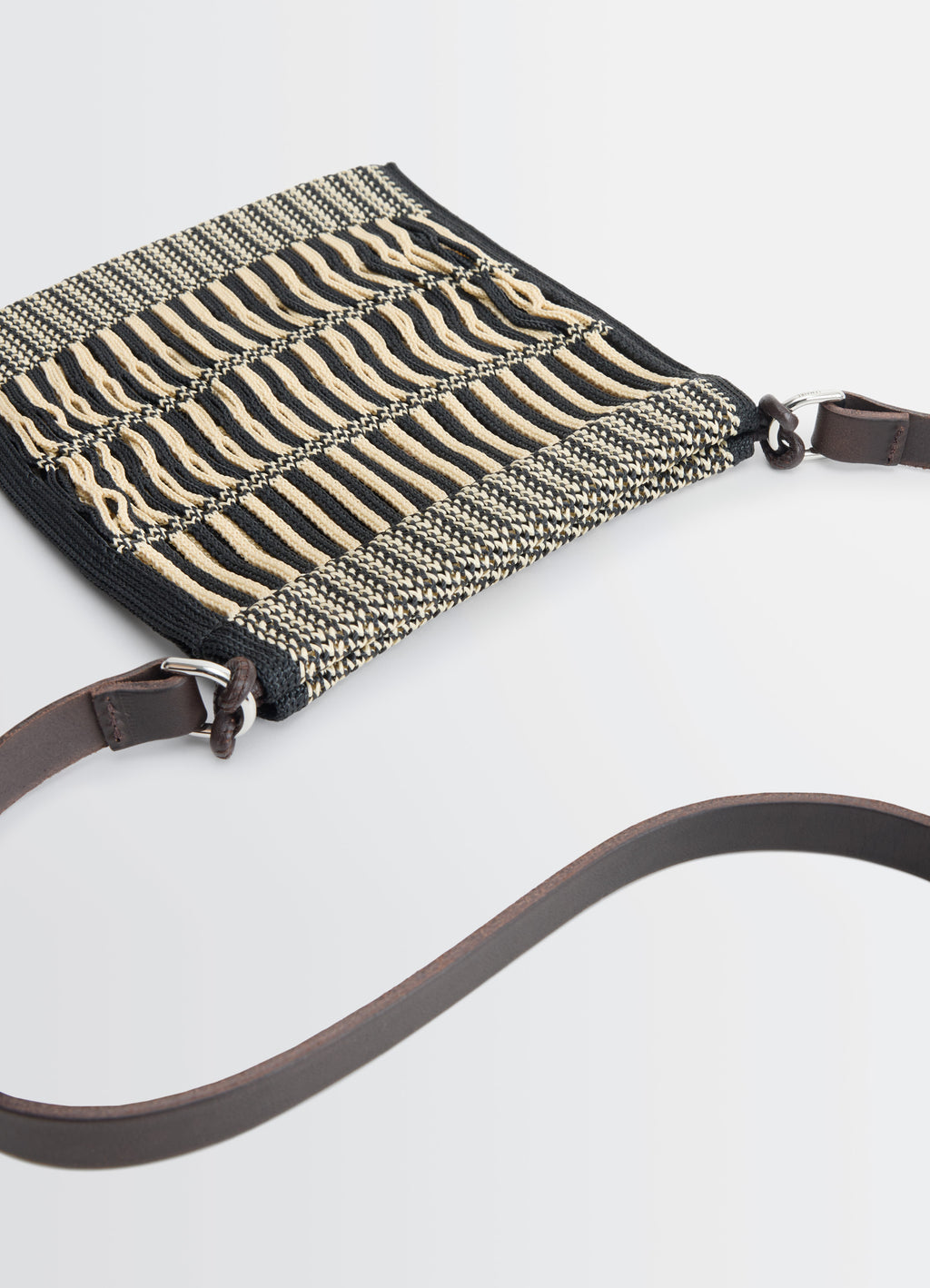 MINI CROSSBODY FILT NET BAG in nylon mesh, vegetable-tanned leathe, product shot, top-down view woven pattern, leather strap