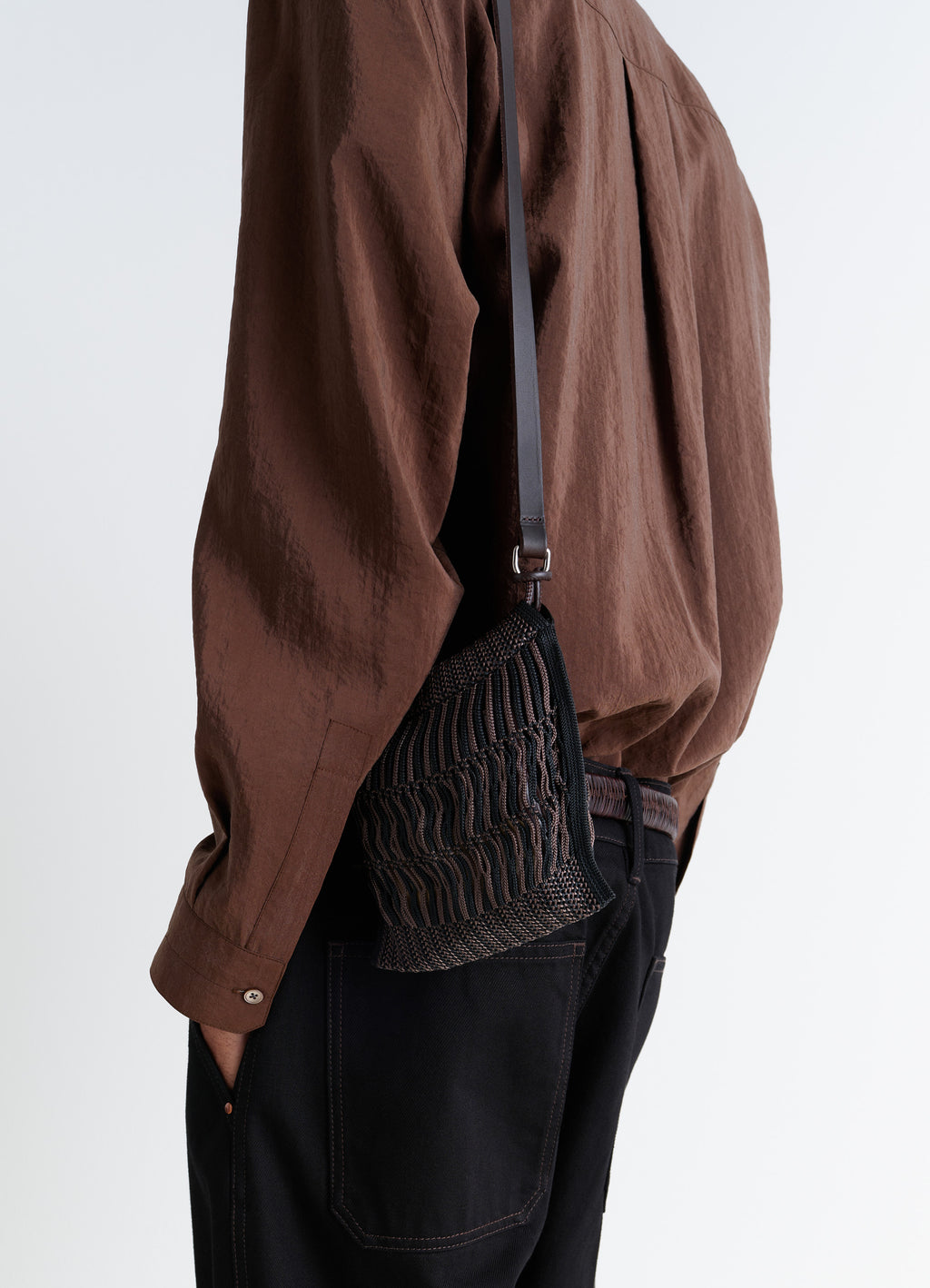 Lemaire MINI CROSSBODY FILT NET BAG in Nylon mesh, vegetable-tanned leathe, model shot, Side view Worn by model