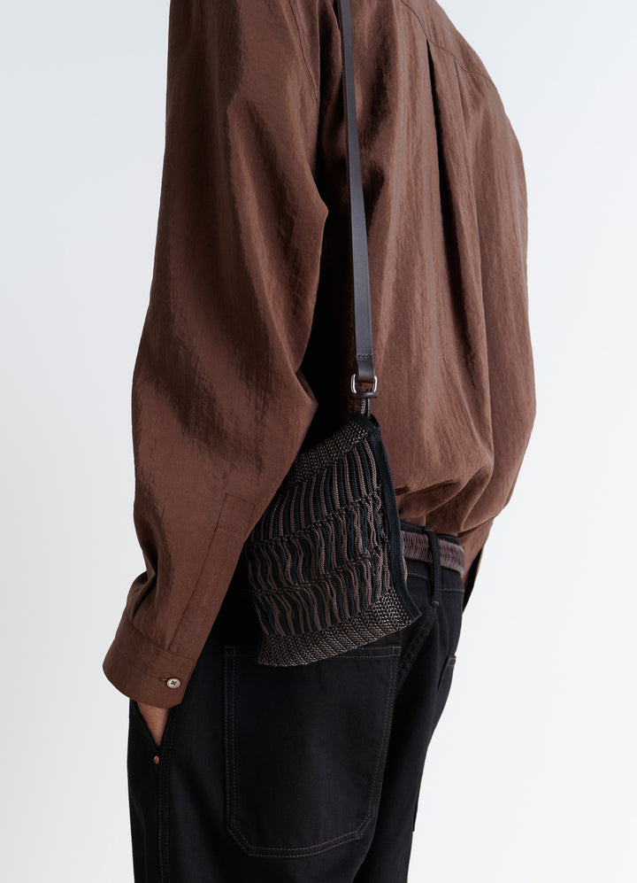 Lemaire MINI CROSSBODY FILT NET BAG in Nylon mesh, vegetable-tanned leathe, model shot, Side view Worn by model