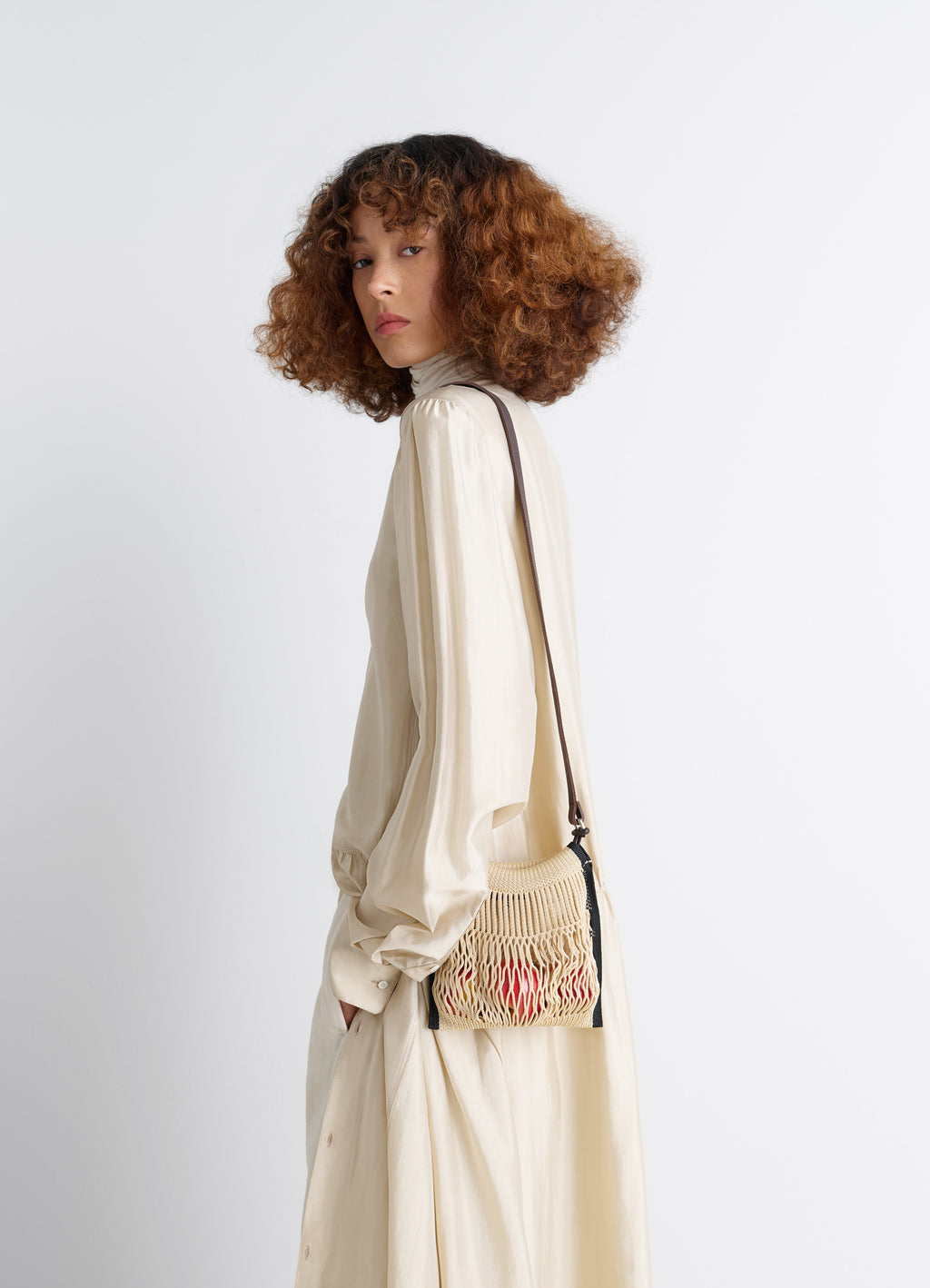 Lemaire x Filt Mini Crossbody in Nylon Mesh, Vegetable-tanned Leathe, model shot, side view mesh texture, long strap