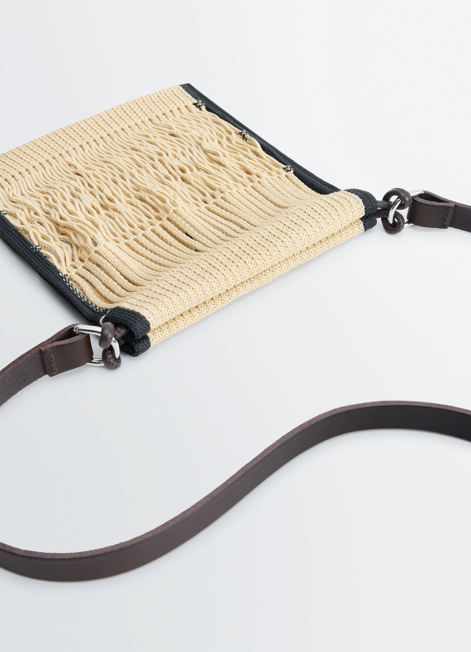 Mini crossbody filt net bag in nylon mesh, leather, product shot, angled detail shot textured net weave