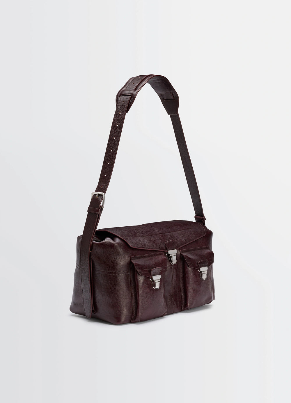 Lemaire Week-End Gear Bag in Glossy Vegetable-Tanned Leather, product shot, three-quarter front view contrasting silver buckl