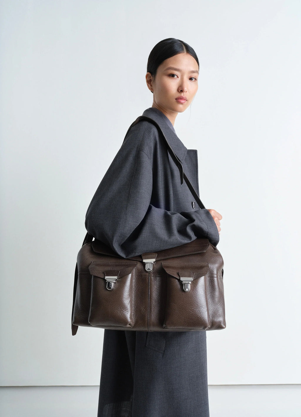 Week-end Gear Bag in Irregular Grained Leather, model shot, 3/4 view worn on shoulder